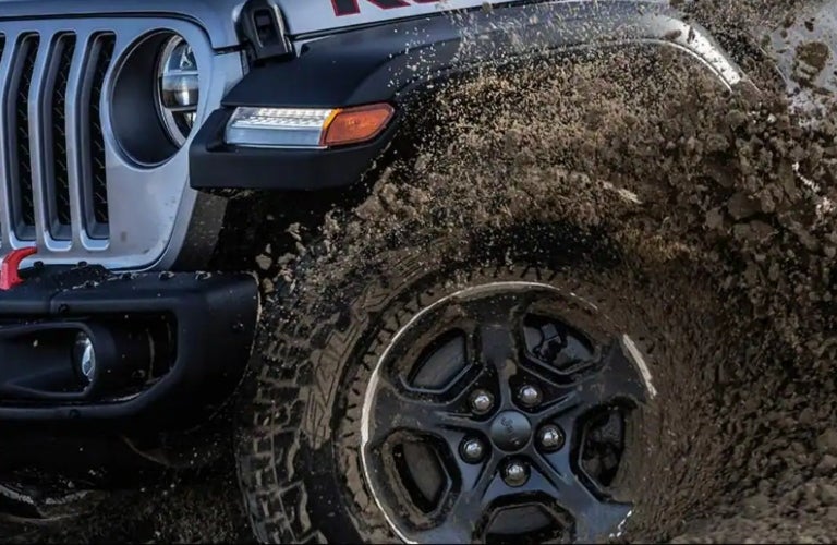 Jeep Gladiator tire driving through mud